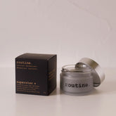 routine Superstar natural deodorant jar with black packaging - frosted glass container showing charcoal-infused cream formula for multi-area odour protection